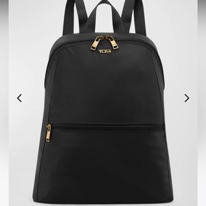 Tumi go anywhere fold up backpack. Never used.